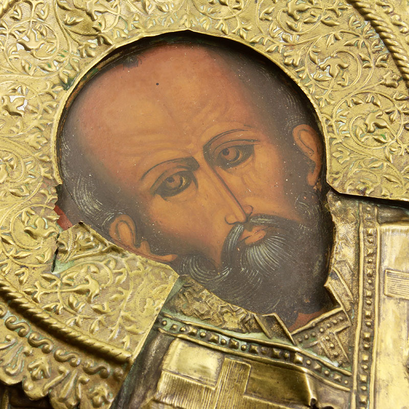 Старинная икона Николай Чудотворец в рельефном латунном окладе. Россия 1880-1900 год