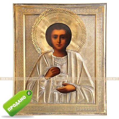 Старинная икона в посеребренном окладе 