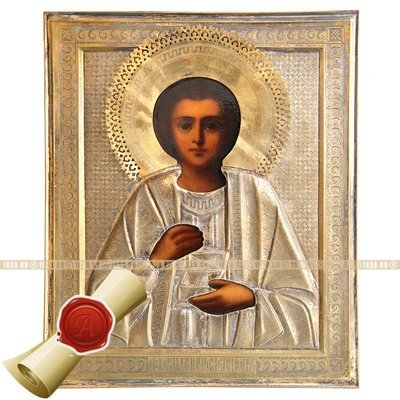 Старинная икона в посеребренном окладе 