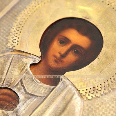 Старинная икона в посеребренном окладе 