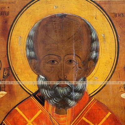 Cтаринная икона святой Николай Чудотворец в латунном посеребренном окладе. Россия 19 век.
