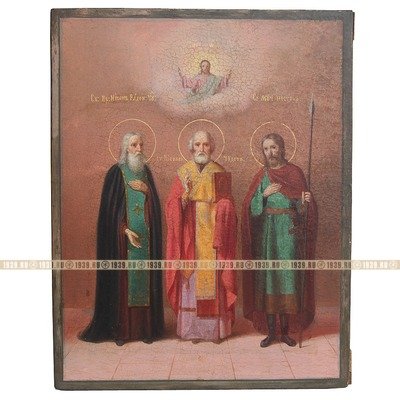 Большая старинная икона 19 века с изображением трех святых: Святитель Николай Чудотворец, Преподобный Никон Радонежский Чудотворец и святой мученик Нестор Солунский.