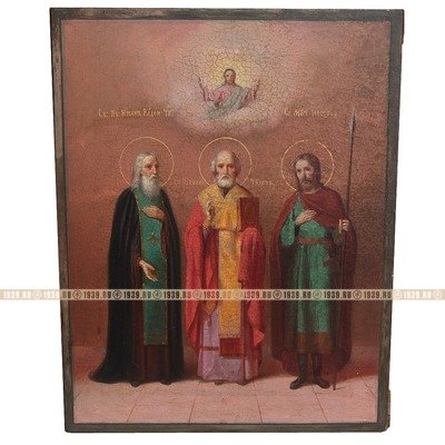 Большая старинная икона 19 века с изображением трех святых: Святитель Николай Чудотворец, Преподобный Никон Радонежский Чудотворец и святой мученик Нестор Солунский.