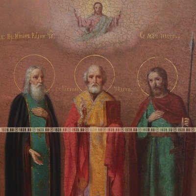 Большая старинная икона 19 века с изображением трех святых: Святитель Николай Чудотворец, Преподобный Никон Радонежский Чудотворец и святой мученик Нестор Солунский.