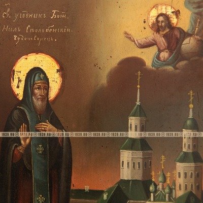 Старинная икона Святой угодник Божий преподобный Нил Столбенский Чудотворец на фоне Нило-Столобенского монастыря, в посеребренном окладе.